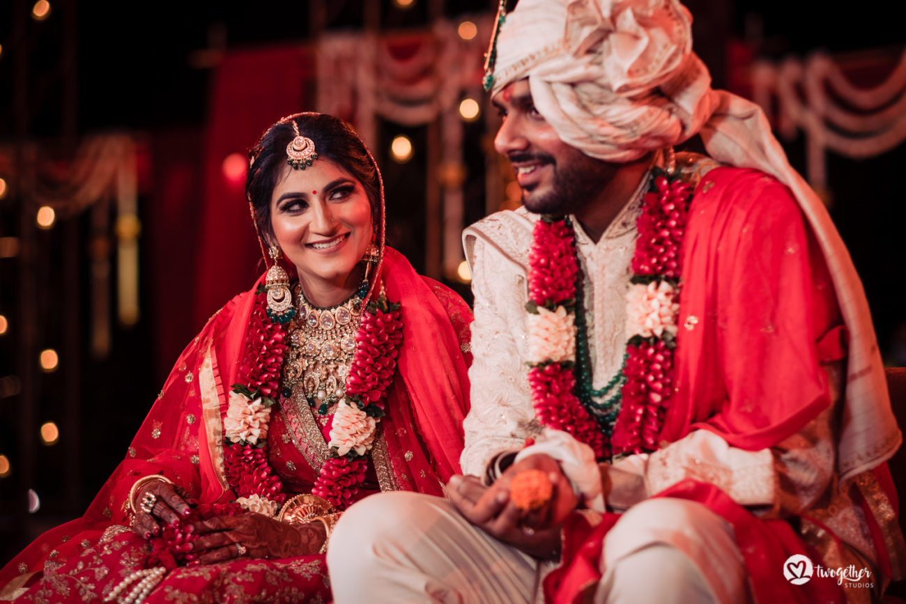 Indian bride and groom in the mandap in an ITC Grand Bharat wedding.