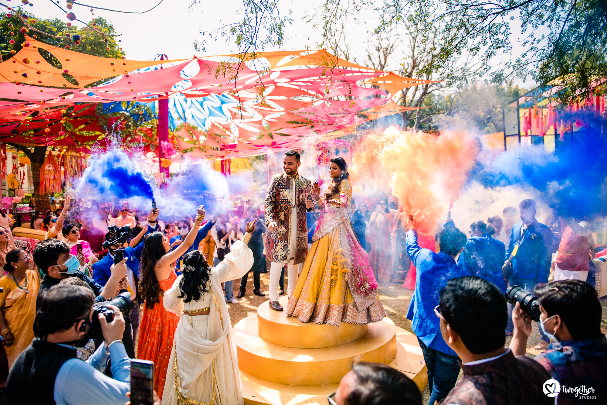 Colour couple entry at Udaipur destination wedding in Udaivilas.